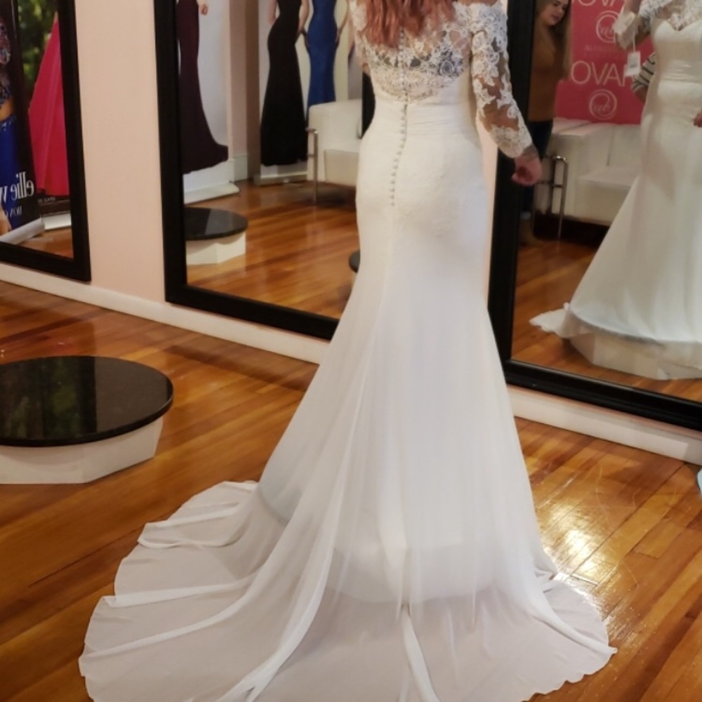 Wedding dress never worn! In bag brand new.